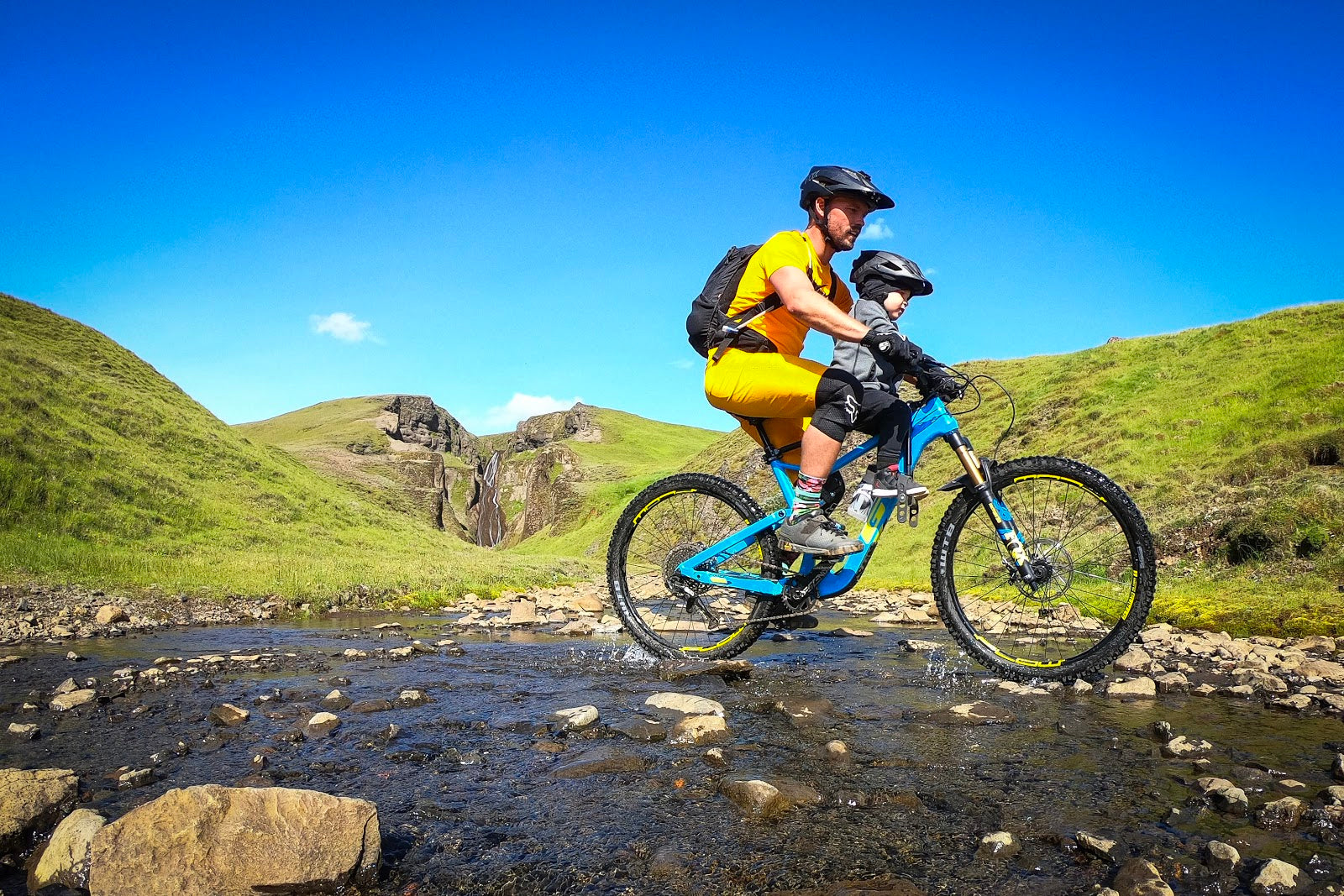 Father and son on a family adventure with their Mac Ride child bike seat. 